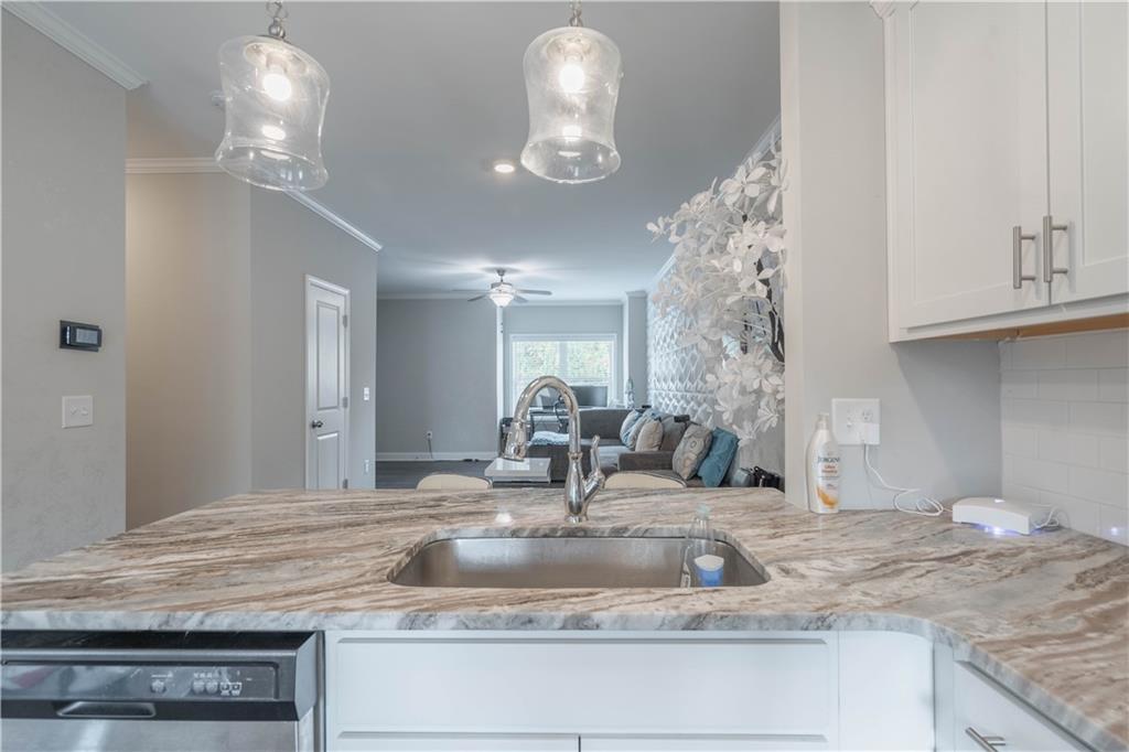 3110 Quantum Lane, Unit 53 Atlanta, GA 30341 - Photo 14 of 38 a bathroom with a granite countertop sink and a mirror