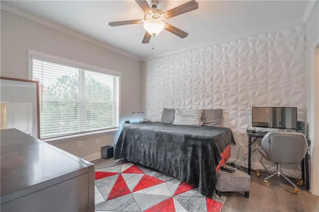 a bedroom with a bed and a desk