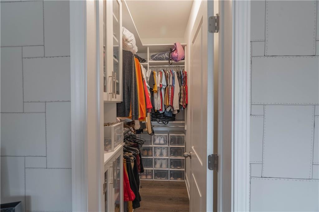 3110 Quantum Lane, Unit 53 Atlanta, GA 30341 - Photo 21 of 38 a view of walk in closet with clothes