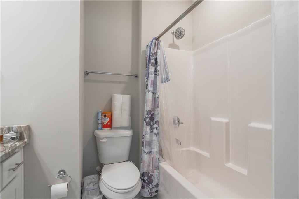 3110 Quantum Lane, Unit 53 Atlanta, GA 30341 - Photo 27 of 38 a white toilet sitting next to a bath tub