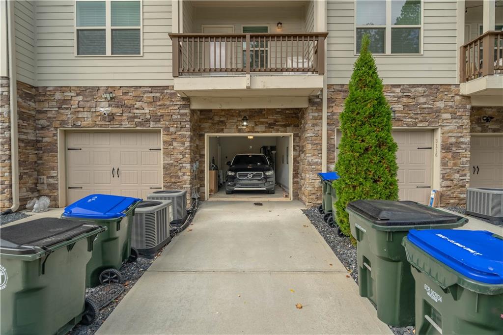 3110 Quantum Lane, Unit 53 Atlanta, GA 30341 - Photo 34 of 38 a view of a house with a fire pit and outdoor seating