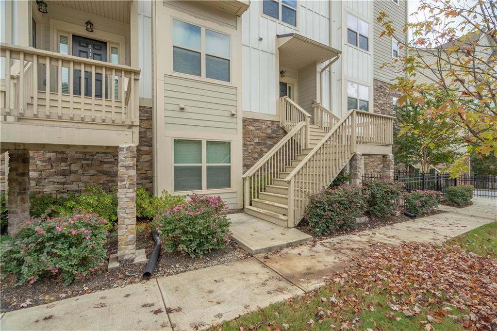 3110 Quantum Lane, Unit 53 Atlanta, GA 30341 - Photo 36 of 38 a view of a house with large windows and plants