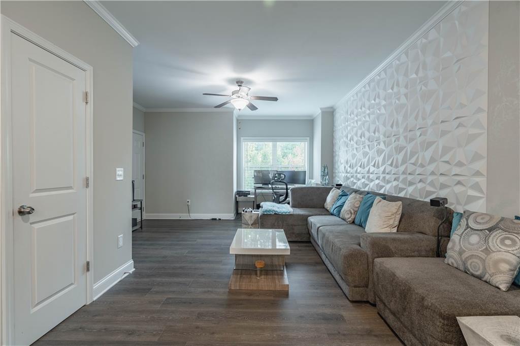 3110 Quantum Lane, Unit 53 Atlanta, GA 30341 - Photo 6 of 38 a living room with furniture and a chandelier