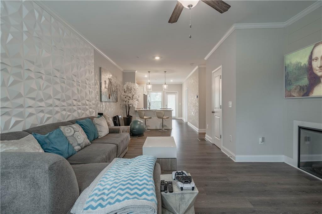 3110 Quantum Lane, Unit 53 Atlanta, GA 30341 - Photo 8 of 38 a living room with furniture and a wooden floor