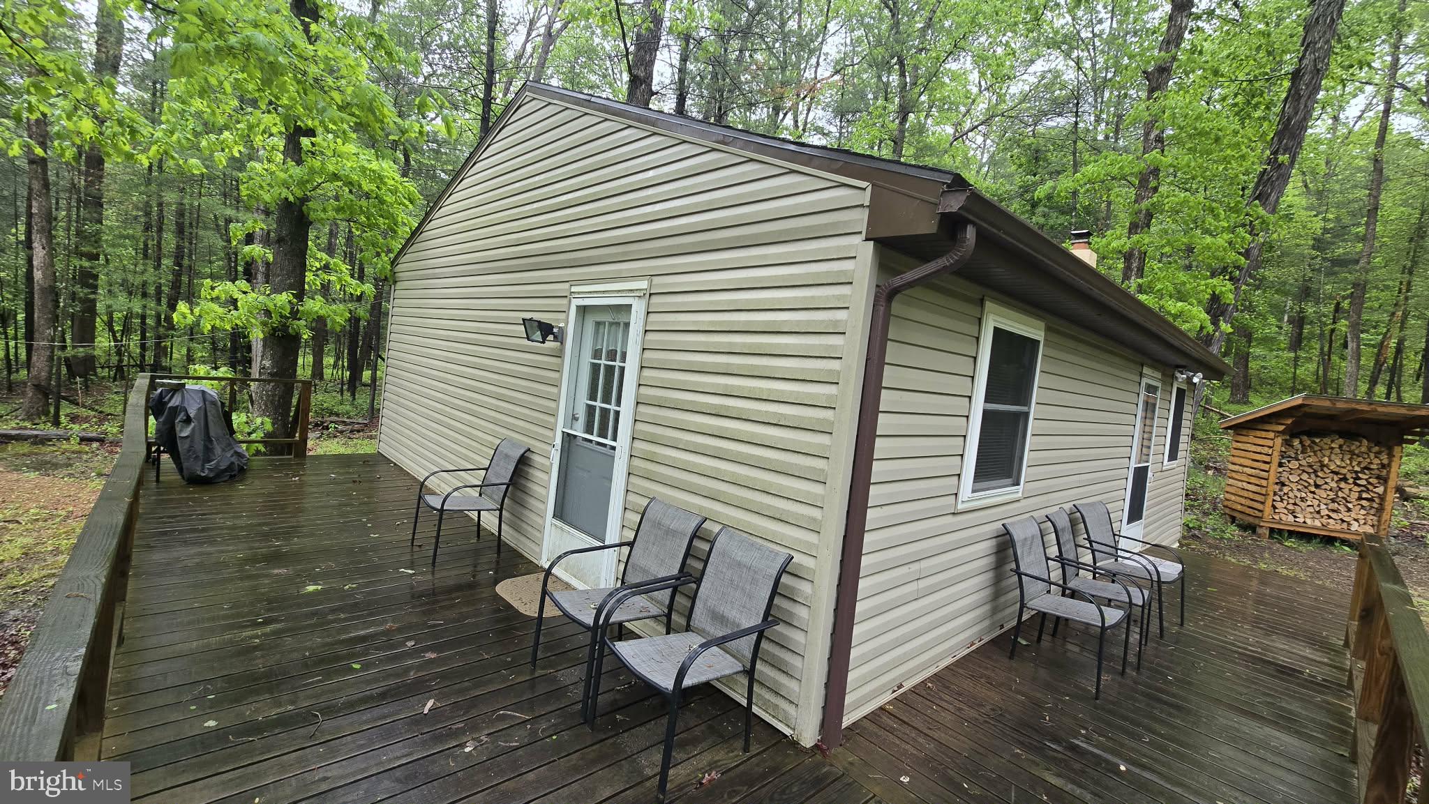 8245 Aughwick Road Fort Loudon, PA 17224 - Photo 23 of 26 a view of a chairs and table on the wooden deck
