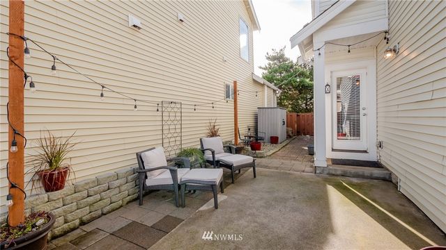 a backyard of a house with outdoor seating