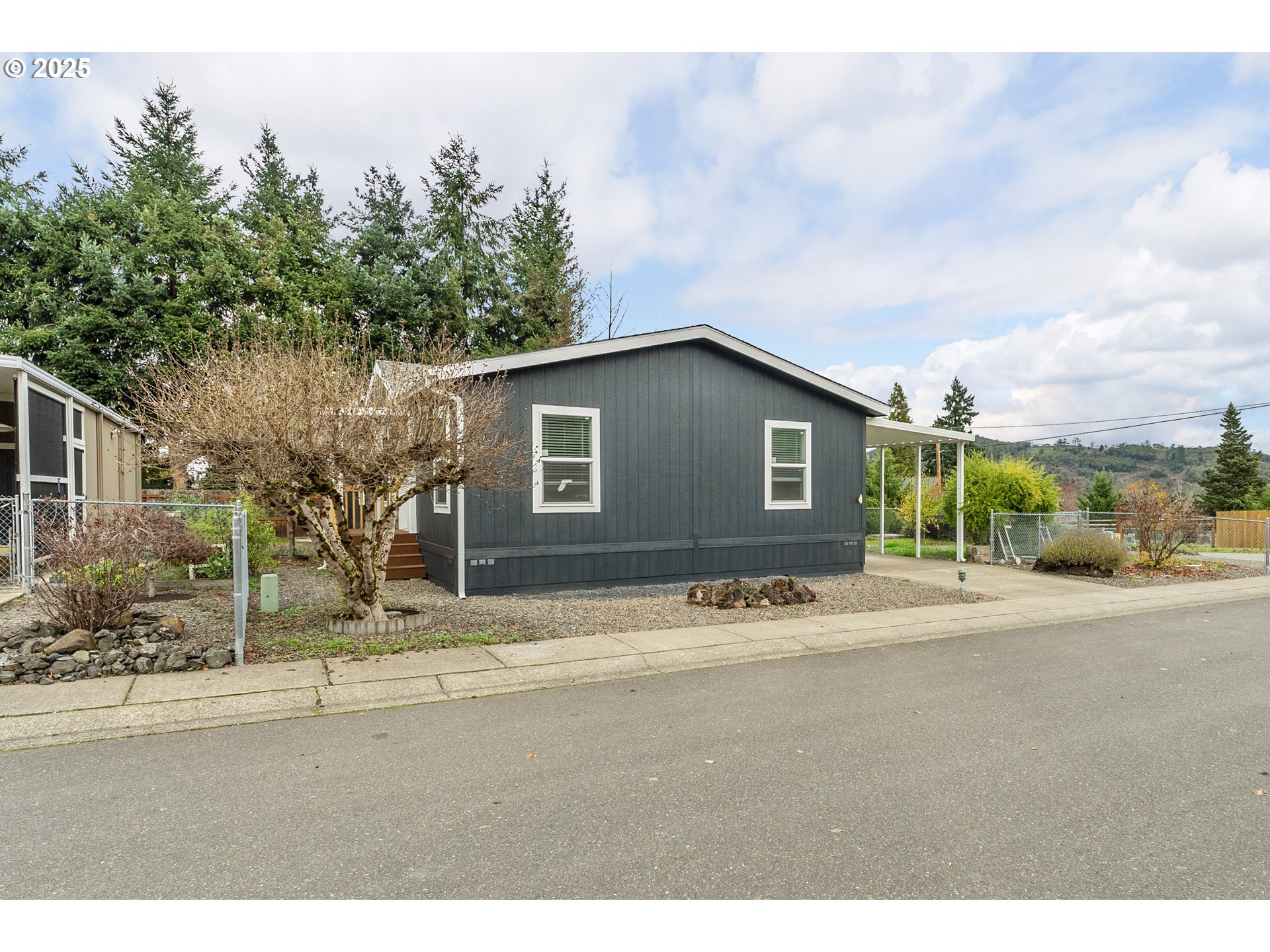 112 Twin Oaks Loop Winston, OR 97496 - Photo 3 of 35 a house with trees in the background