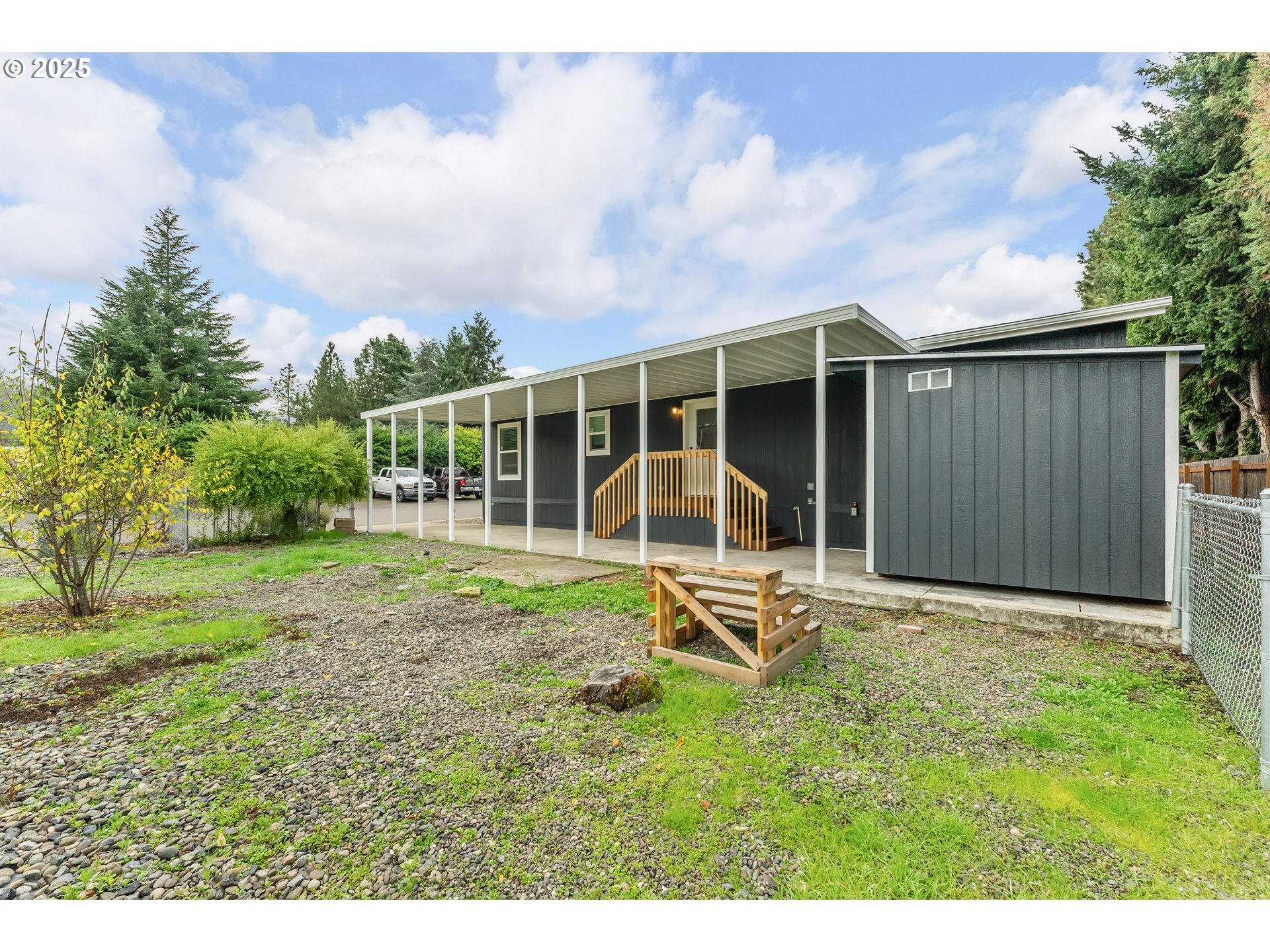 112 Twin Oaks Loop Winston, OR 97496 - Photo 32 of 35 a view of a house with backyard porch and sitting area