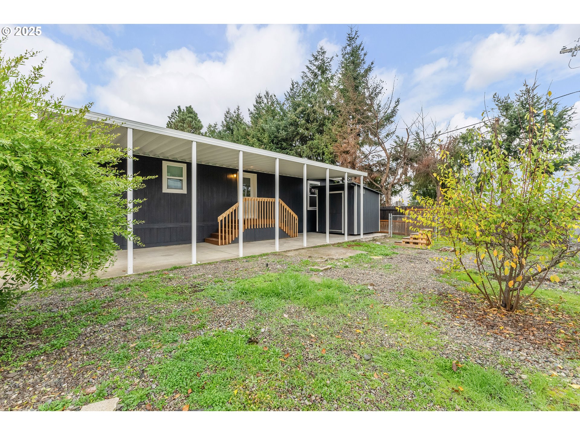 112 Twin Oaks Loop Winston, OR 97496 - Photo 33 of 35 a view of a backyard with potted plants and large tree