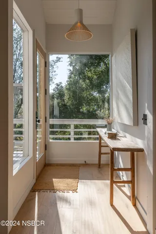 a view of a room with balcony and furniture