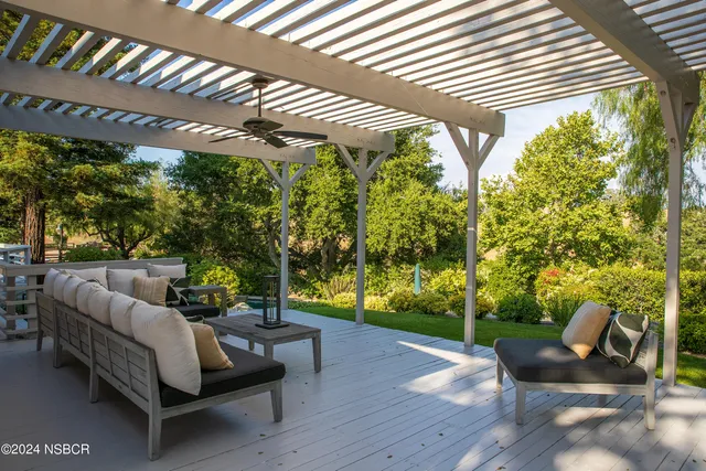 a outdoor living space with furniture and garden view