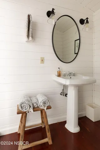 a bathroom with a sink and mirror
