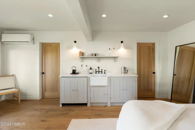 a spacious bathroom with a sink a mirror and a toilet