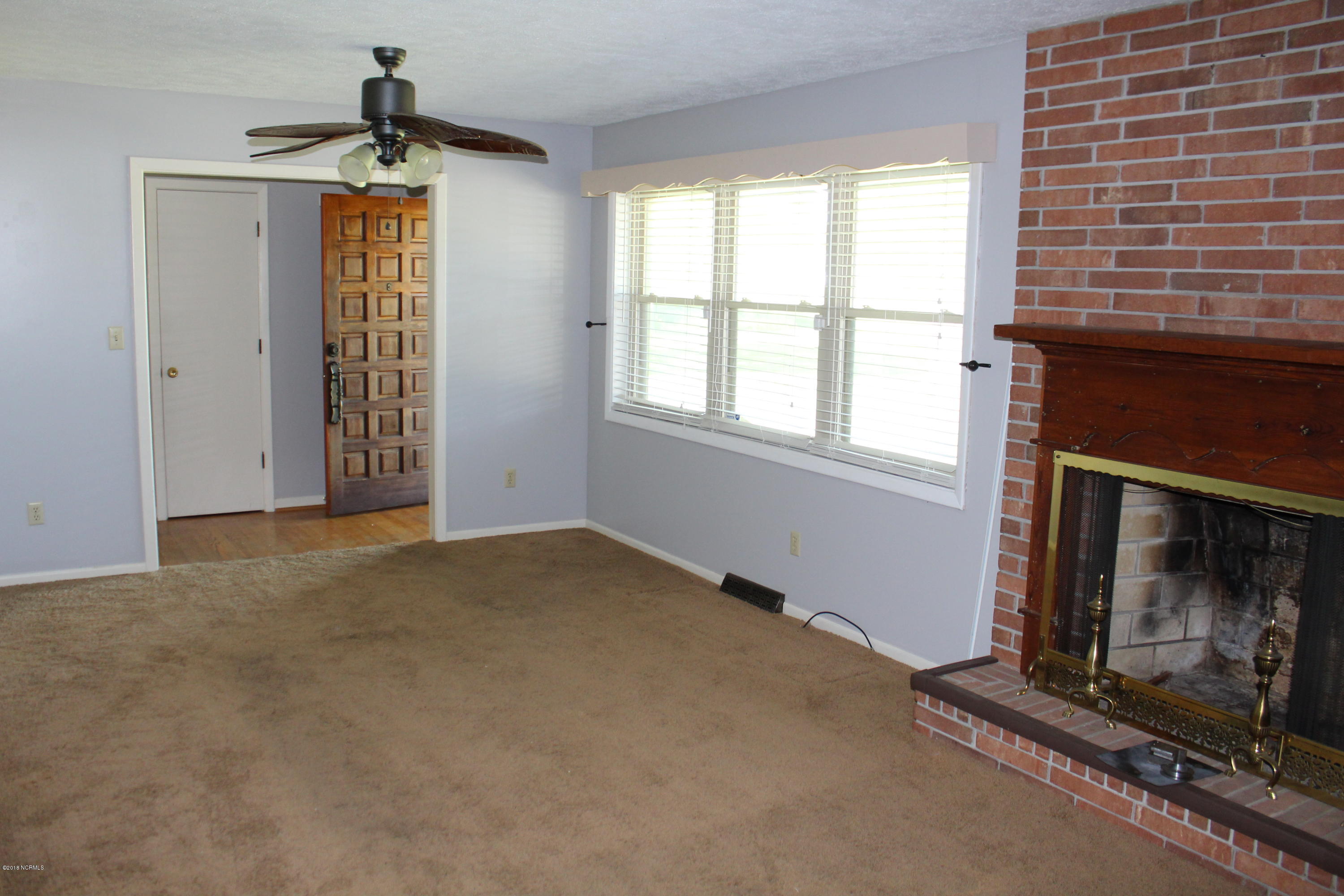 865 Tedder Road Ivanhoe, NC 28447 - Photo 10 of 32 Living Room with wood burning fire place