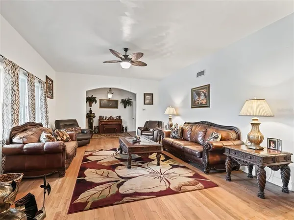 a kitchen with stainless steel appliances kitchen island granite countertop a refrigerator stove and oven