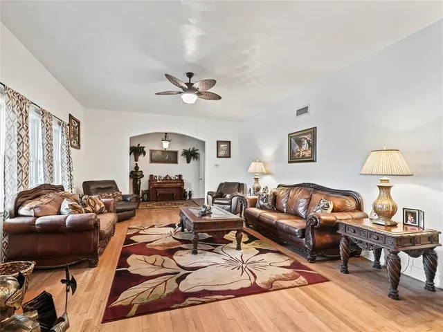 a kitchen with stainless steel appliances kitchen island granite countertop a refrigerator stove and oven