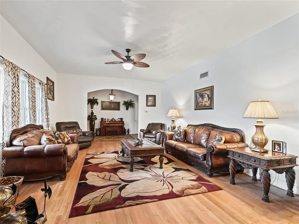 6994 Northwest Highway 320 Micanopy, FL 32667 - Photo 11 of 45 a living room with furniture and a lamp