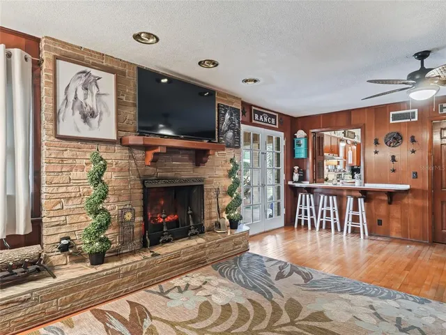 a en suite bathroom with a granite countertop sink and a mirror