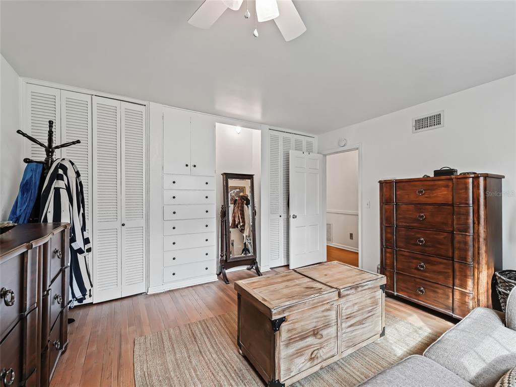 6994 Northwest Highway 320 Micanopy, FL 32667 - Photo 23 of 45 a bedroom with a bed and a dresser