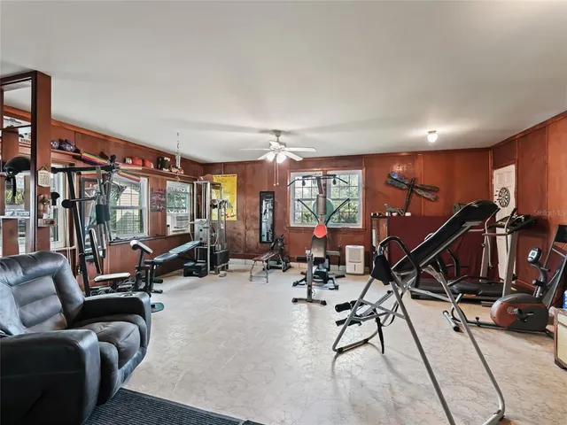 a front view of a house with yard and green space