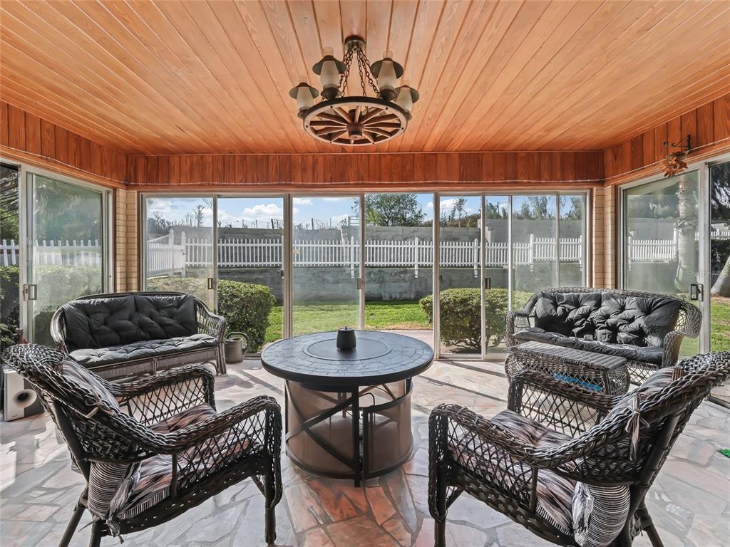 6994 Northwest Highway 320 Micanopy, FL 32667 - Photo 28 of 45 a outdoor living space with patio furniture and a potted plant