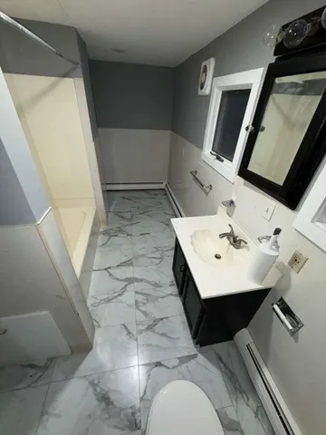 a view of a hallway with washer and dryer