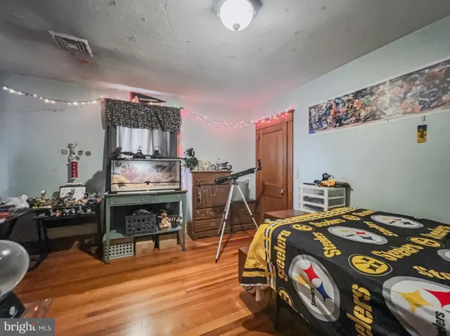 a bedroom with furniture and a fireplace
