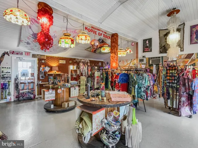 a view of a dining room with clothes and shoes