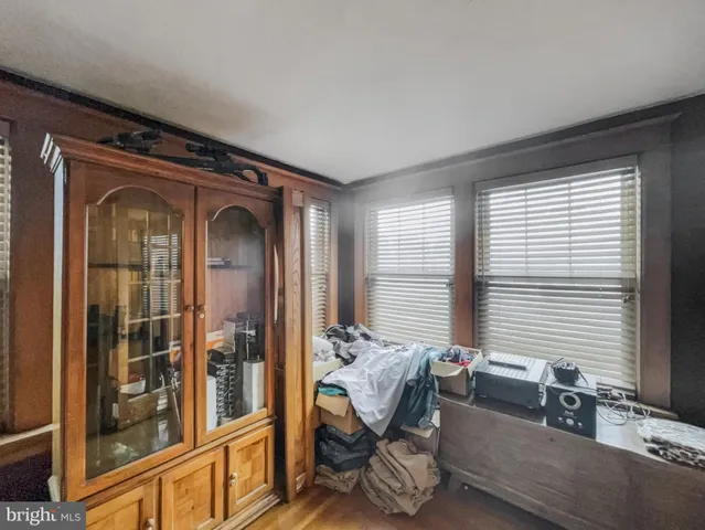 a livingroom with window and lounge chair