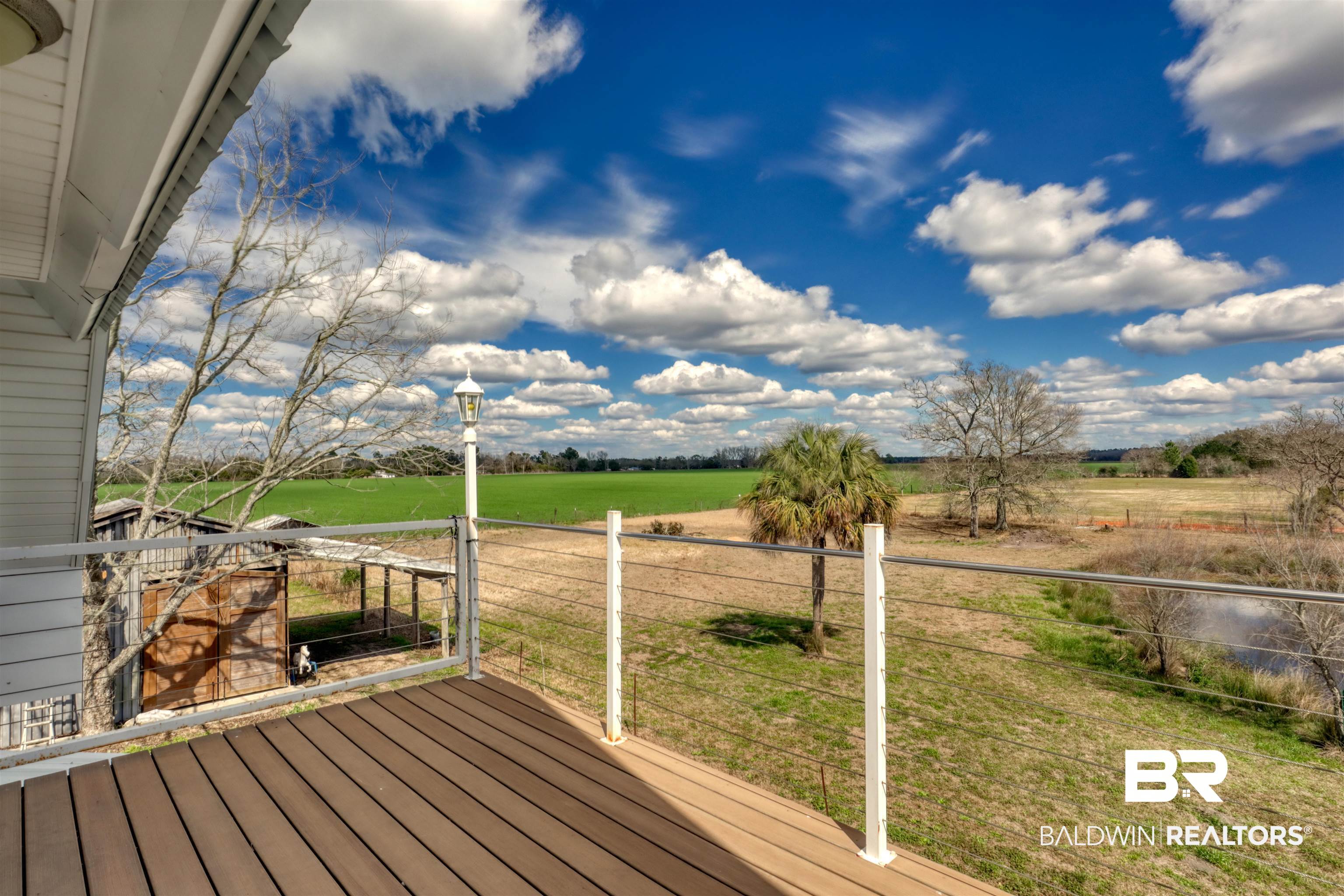 28461 Gardner Road Elberta, AL 36530 - Photo 26 of 46 Wooden deck with a yard and a view of rural / pastoral area