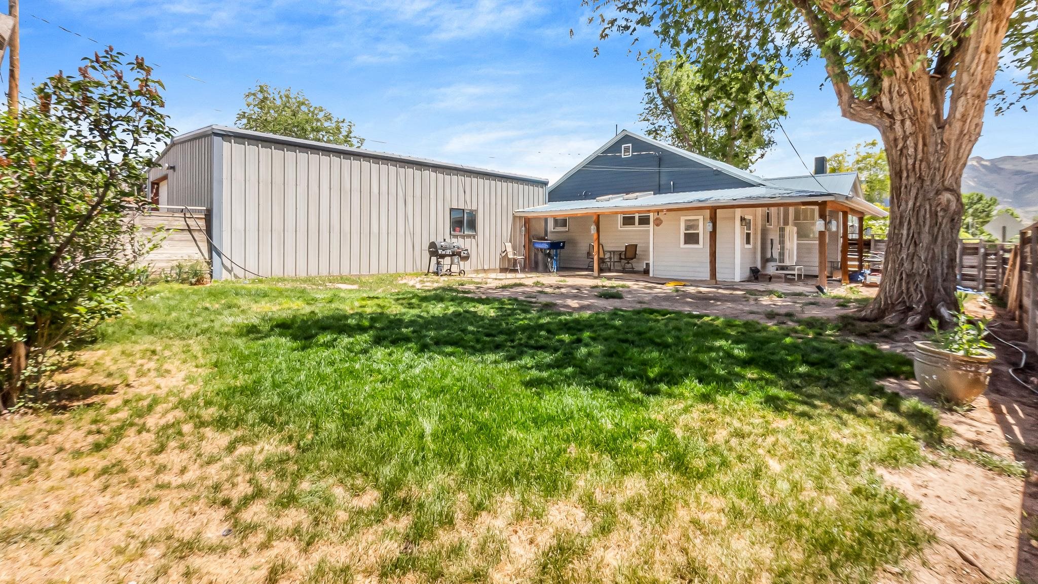 208 3rd Street Parachute, CO 81635 - Photo 36 of 40 a house view with a garden space