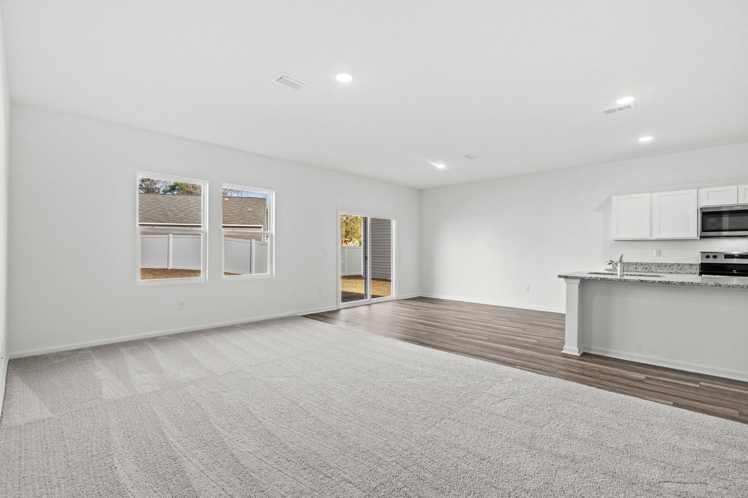 349 Sporting Drive Aynor, SC 29511 - Photo 9 of 31 Unfurnished living room with baseboards and recessed lighting