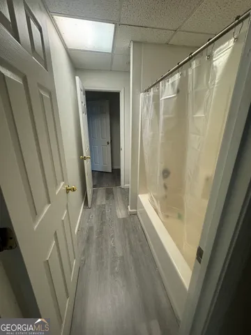 a bathroom with a bathtub and a shower