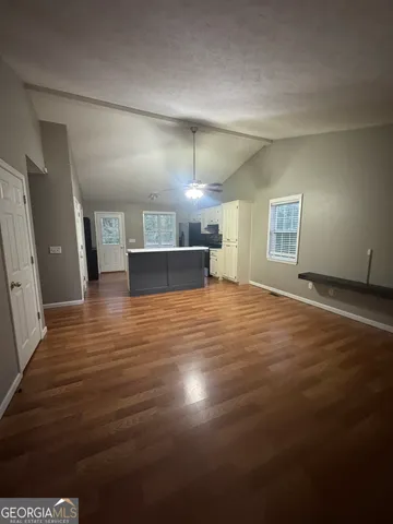 a view of a livingroom with a kitchen