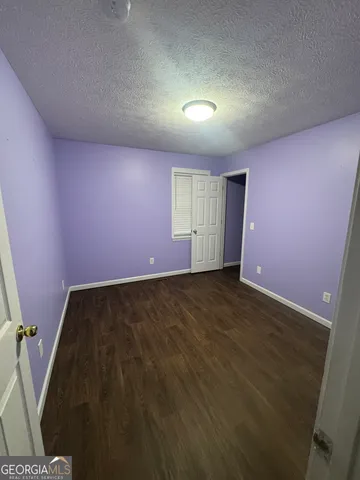 wooden floor and window in an empty room