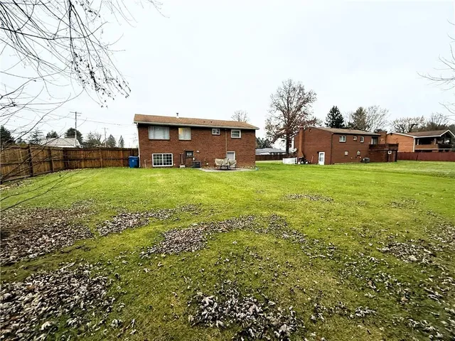 a view of a house with a big yard