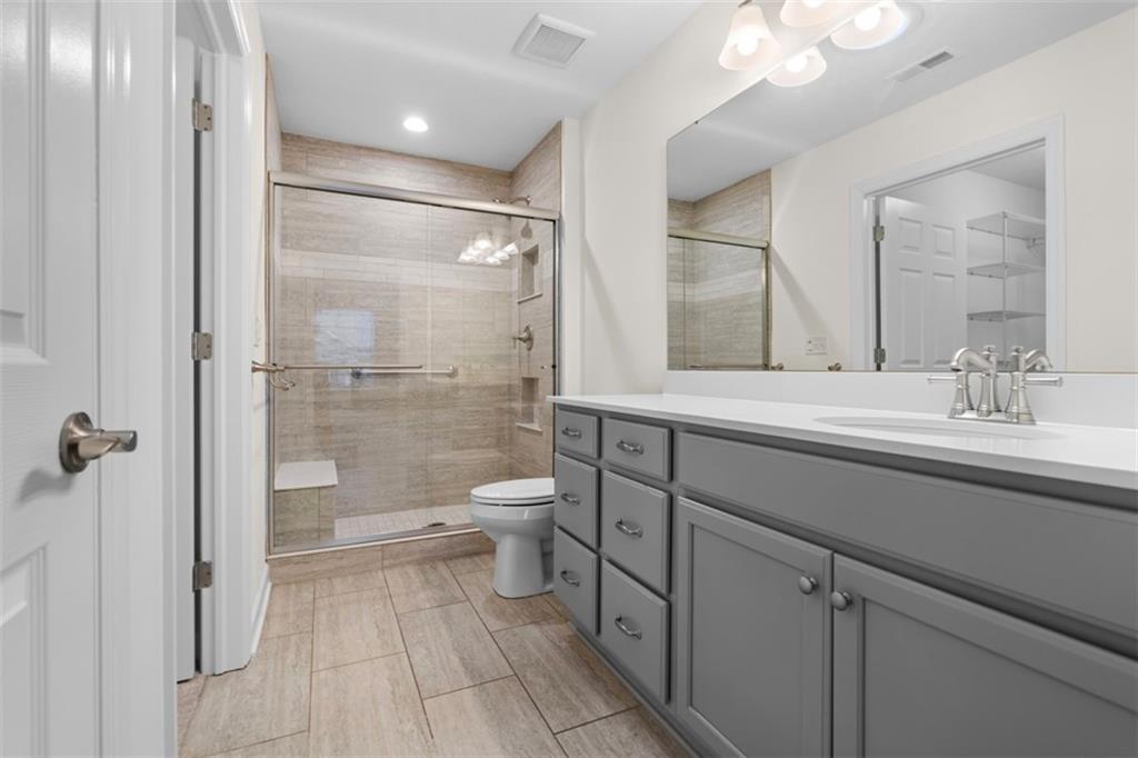 1024 Tilly Drive Valencia, PA 16059 - Photo 17 of 35 a bathroom with a sink shower and a toilet