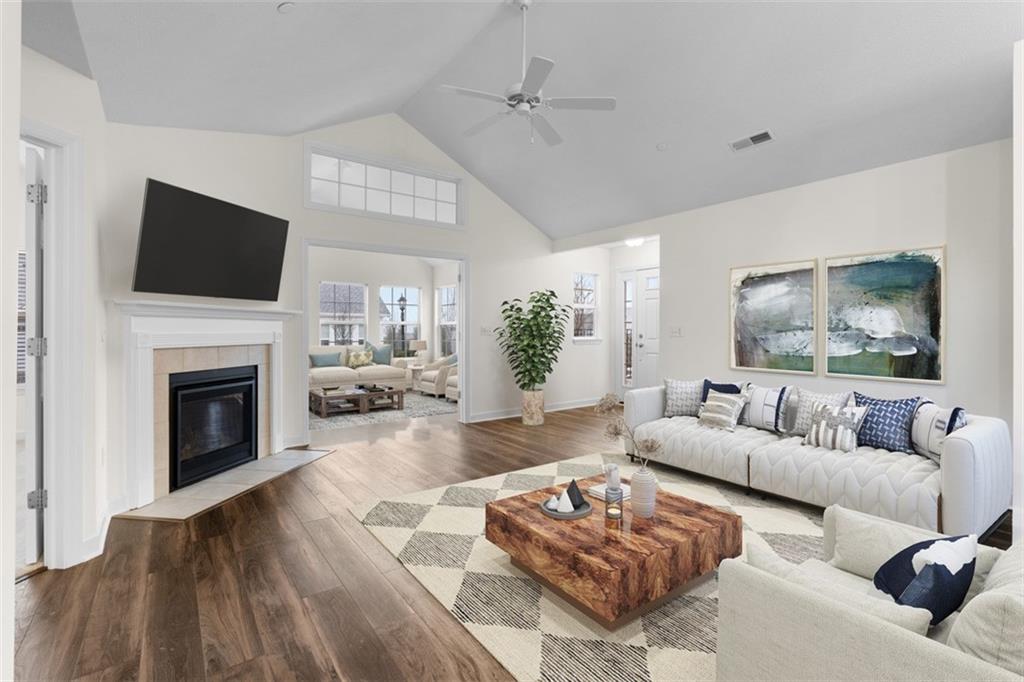 1024 Tilly Drive Valencia, PA 16059 - Photo 3 of 35 a living room with furniture a fireplace and a flat screen tv