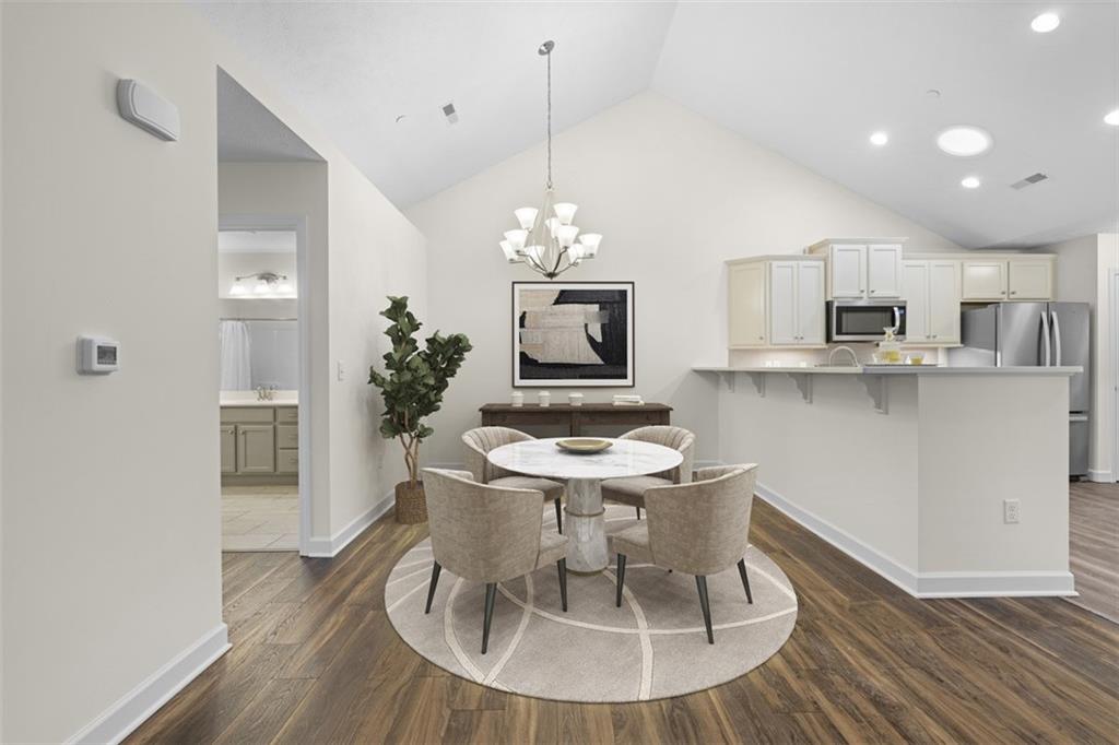 1024 Tilly Drive Valencia, PA 16059 - Photo 4 of 35 a dining room with furniture a chandelier and wooden floor