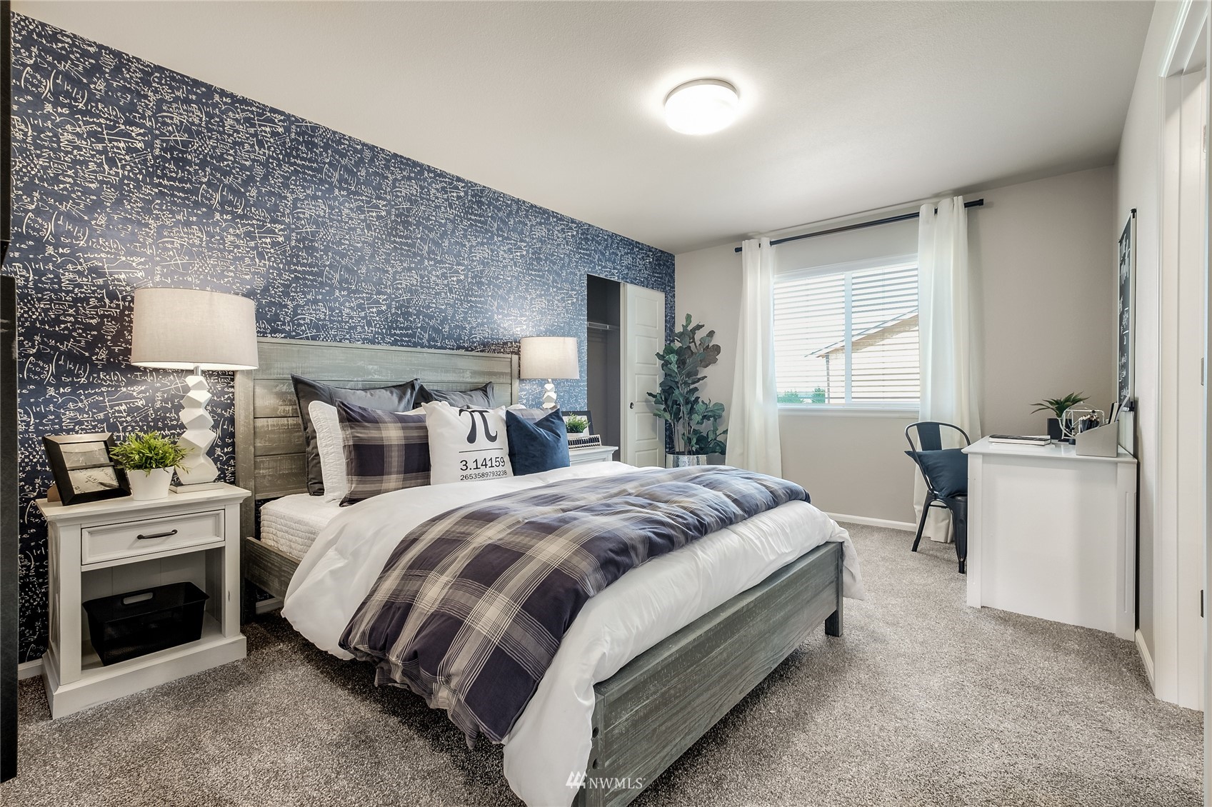 19431 9th Avenue Southeast, Unit 6 Bothell, WA 98012 - Photo 5 of 21 a spacious bedroom with a bed and a cabinets