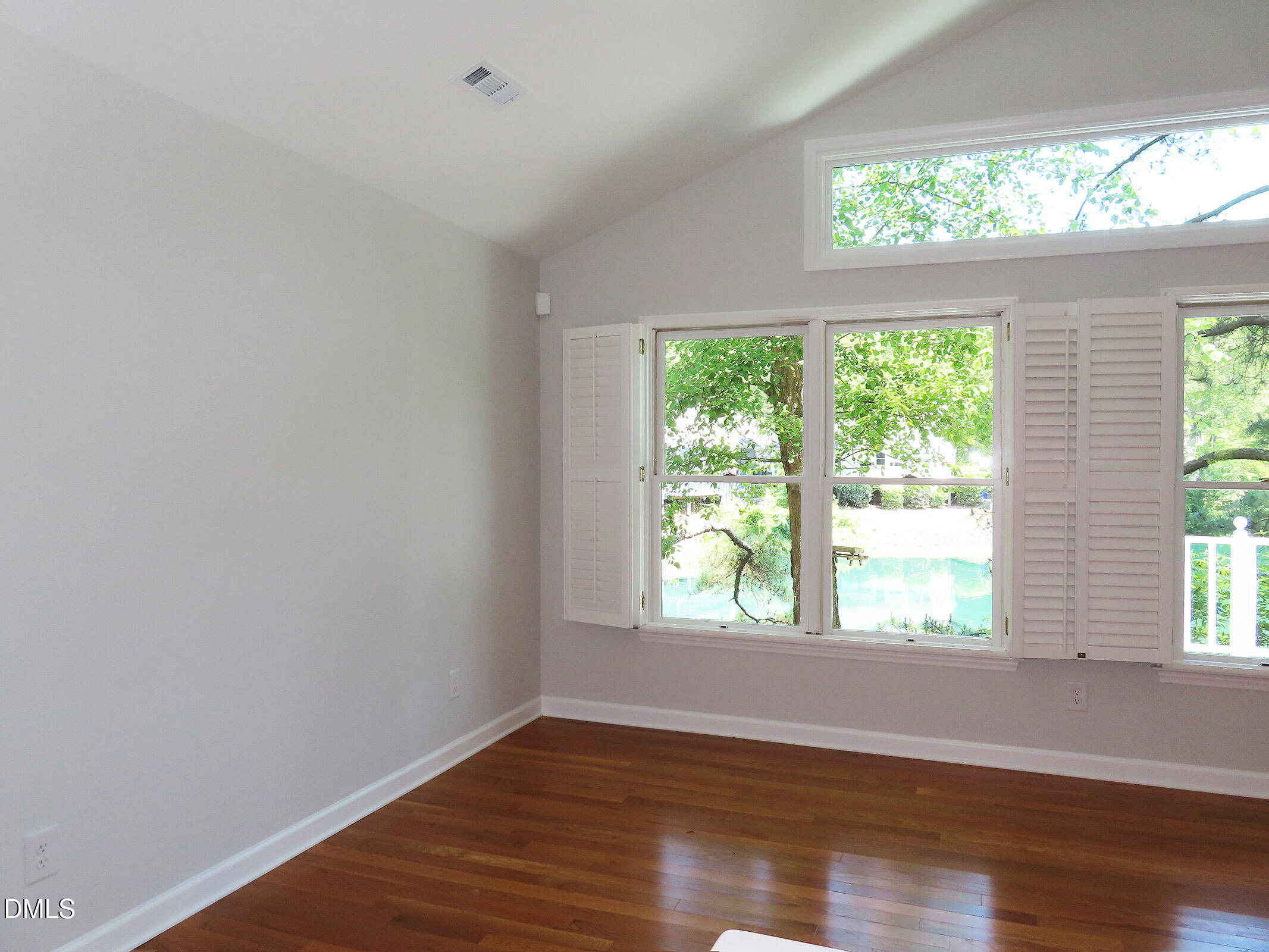 120 Weatherhill Point Carrboro, NC 27510 - Photo 4 of 25 an empty room with wooden floor and windows