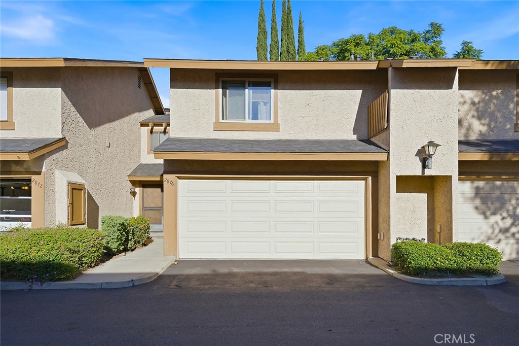 front view of a house with a street