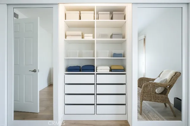 a view of a hallway with closet