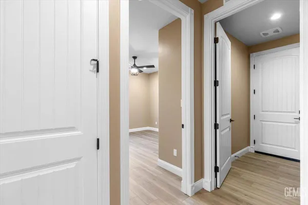 a view of a bathroom from a hallway