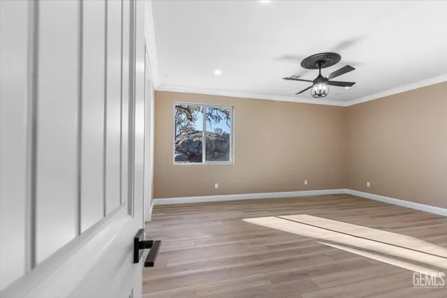 wooden floor in a hall with a window