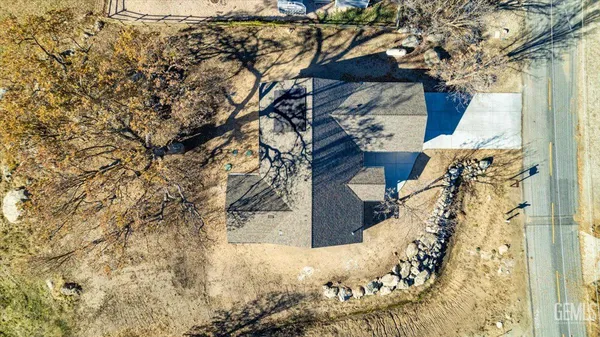 a view of a tree in front of a house