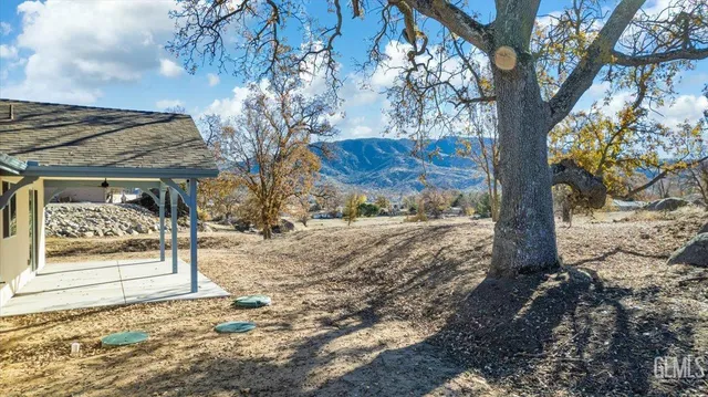 a view of a backyard of the house