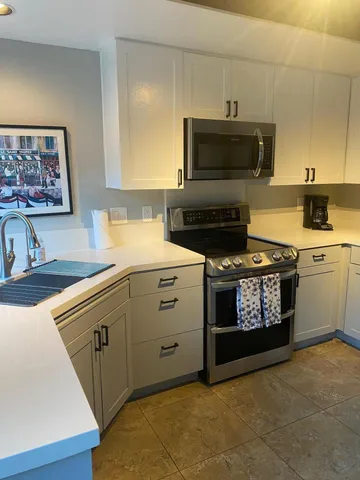 a kitchen with a stove and a microwave