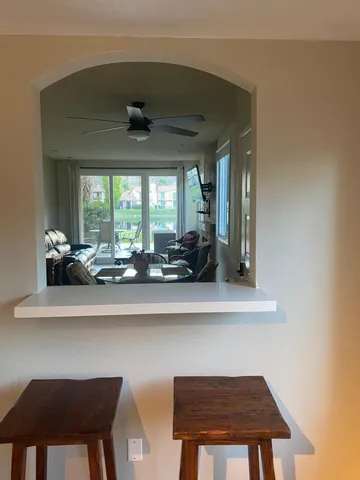 a dining room with furniture and window