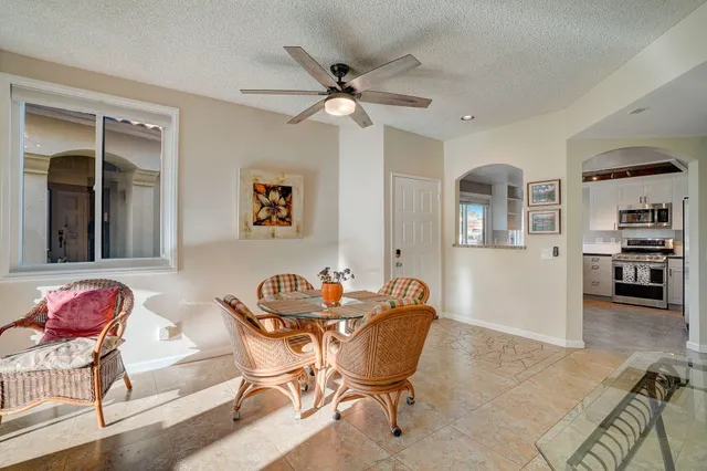 a dining room with furniture and window